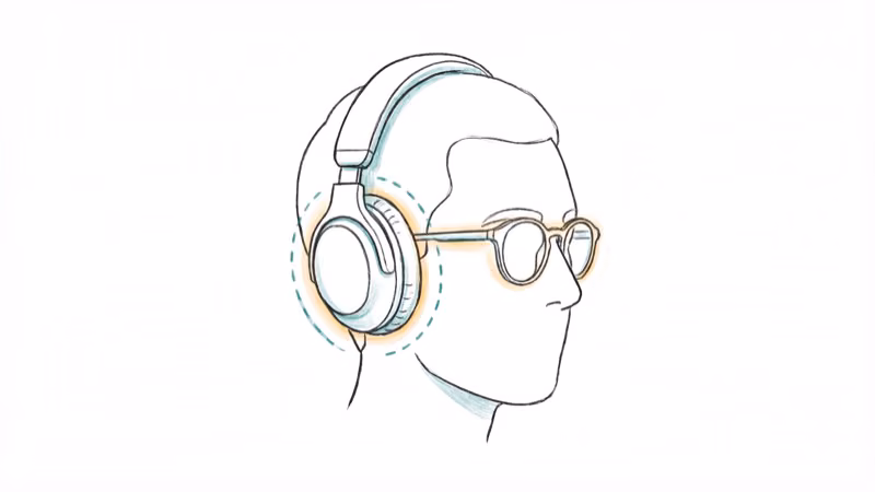 Over-ear headphones being worn with glasses showing comfort fit design