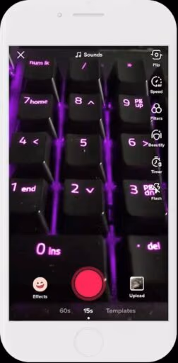 Open TikTok and press the + symbol